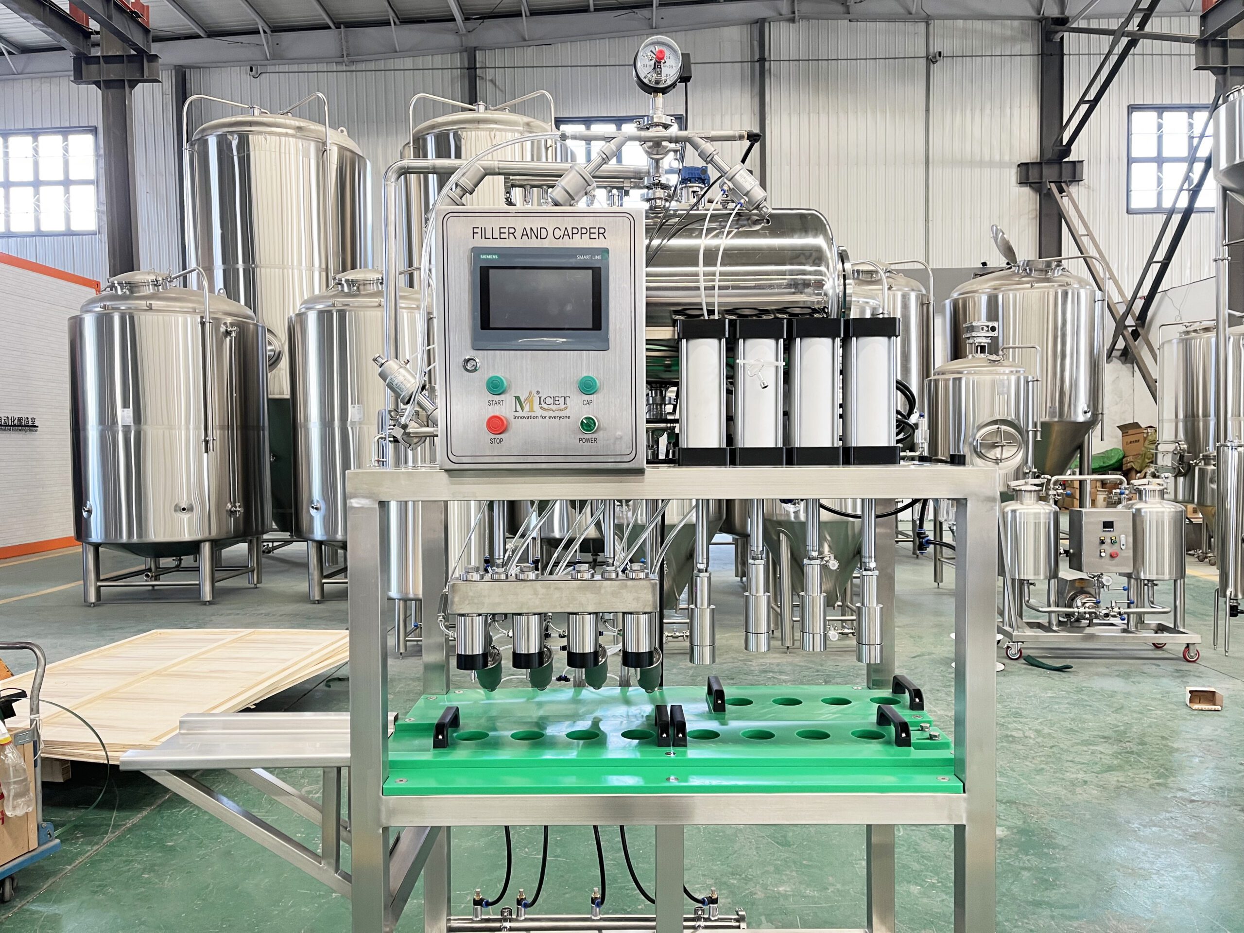 1 9 scaled 4-Head Manual Bottle Filling and Capping Machine
